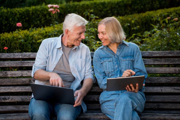 Senior couple using tablets in a Yakima garden