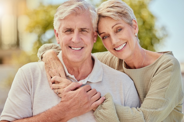 Mature couple enjoying a warm moment together, representing dating after 50 in Plano, Texas