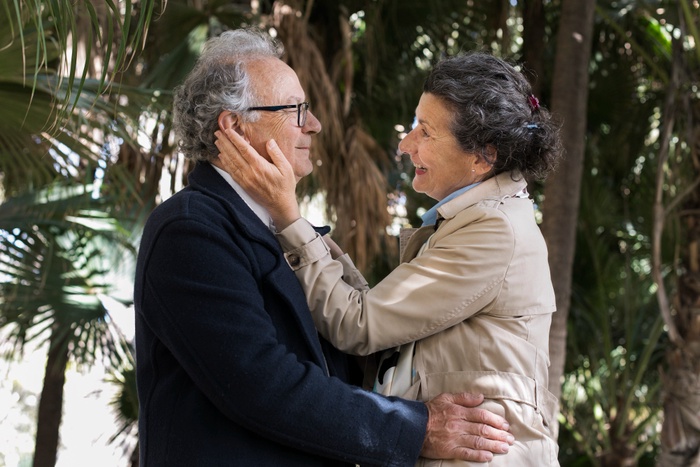 Senior couple sharing an affectionate moment outdoors