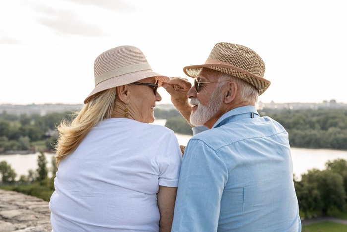 Older couple sitting by the river in Roswell, Georgia