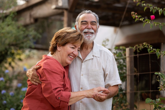 Older couple talking during a relaxed outdoor visit in Southfield