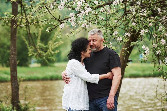Mature couple spending time together in a leafy Bowie park