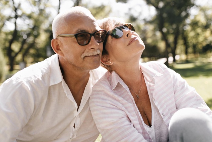 Older couple relaxing together in a sunny park in Lake Mary, Florida