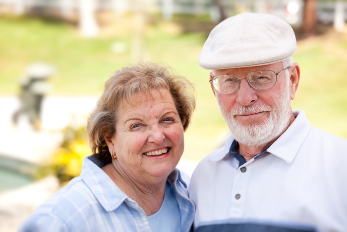 Older couple smiling together during a walk outdoors