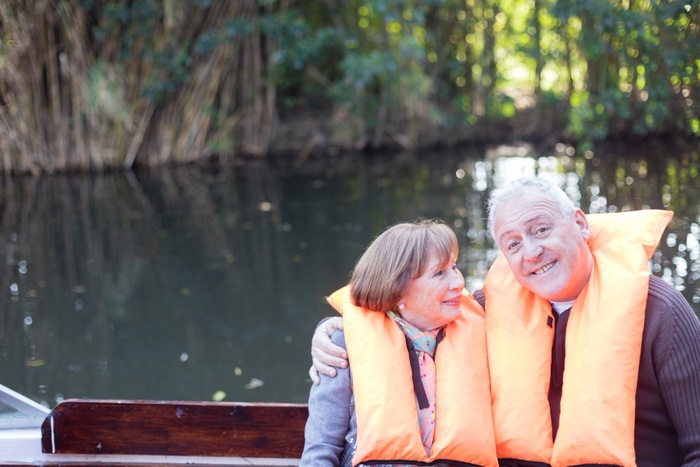 Mature couple enjoying a relaxed boat trip together