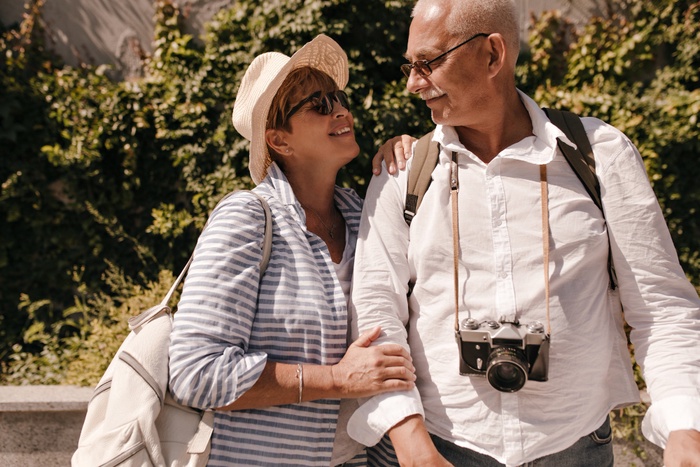 Older couple having a relaxed conversation in a shaded High Desert public setting