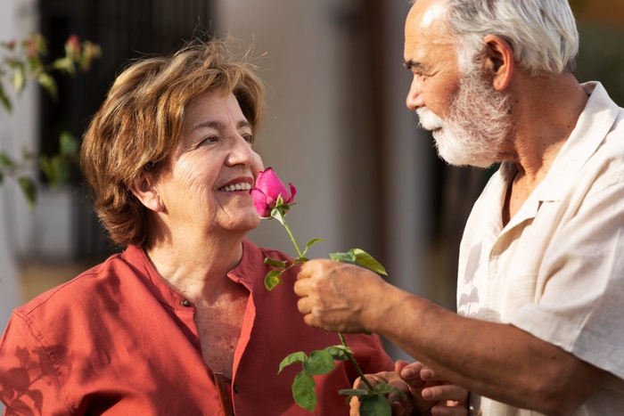 Mature couple enjoying a garden walk at Corbett Gardens in Bowral