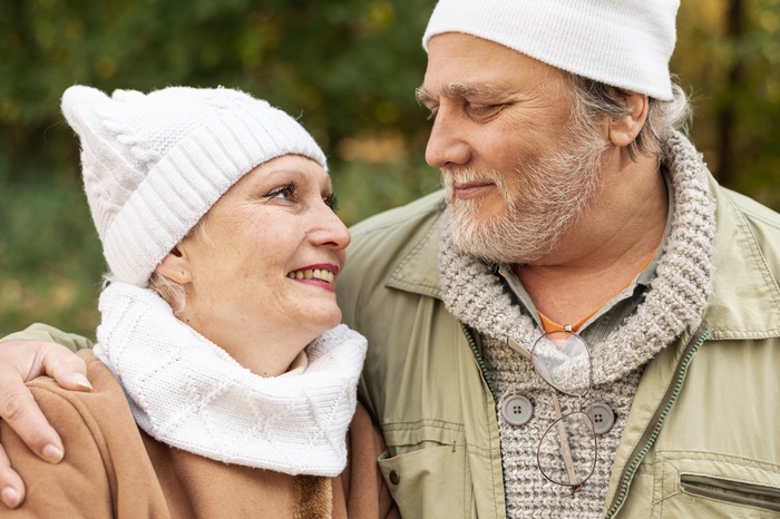 Senior couple enjoying a relaxed conversation outdoors