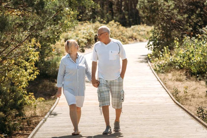 Older couple walking through a park in Narangba, Queensland