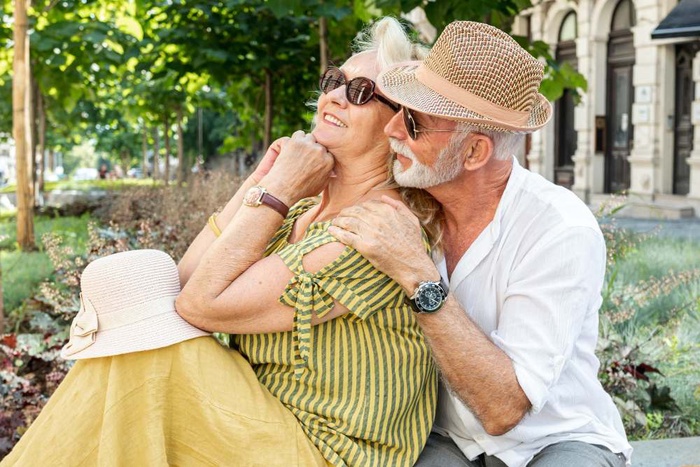 Older couple embracing in a park in Frederick, Maryland