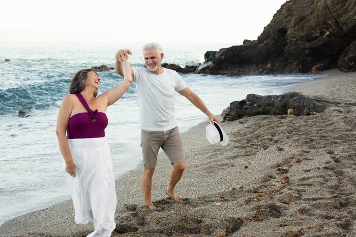 Mature couple enjoying a scenic Hawaii beach
