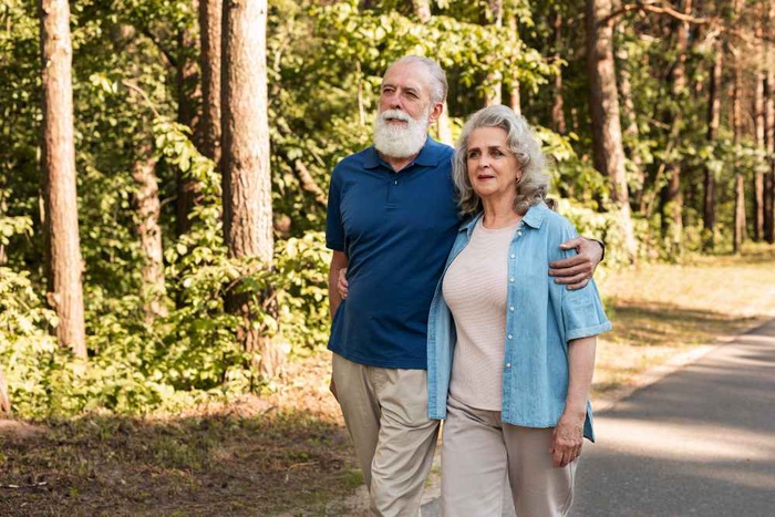 Mature couple walking along a trail in Middletown