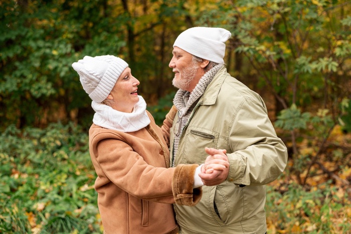 Mature couple enjoying a daytime walk in a Glen Burnie park