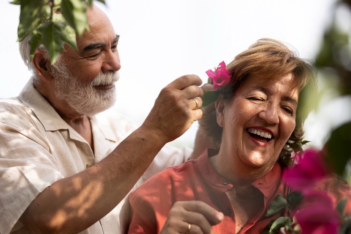 Smiling couple over 50 enjoying time together outdoors