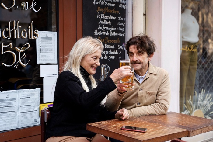 Mature couple enjoying a relaxed conversation at a café