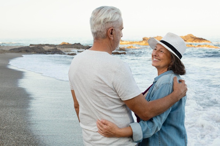 A mature couple along the beach in White Rock