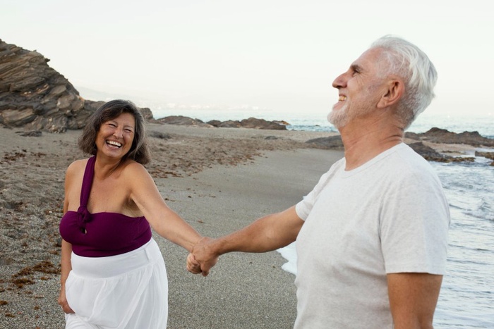 Older couple enjoying a seaside date in Clacton-on-Sea, England