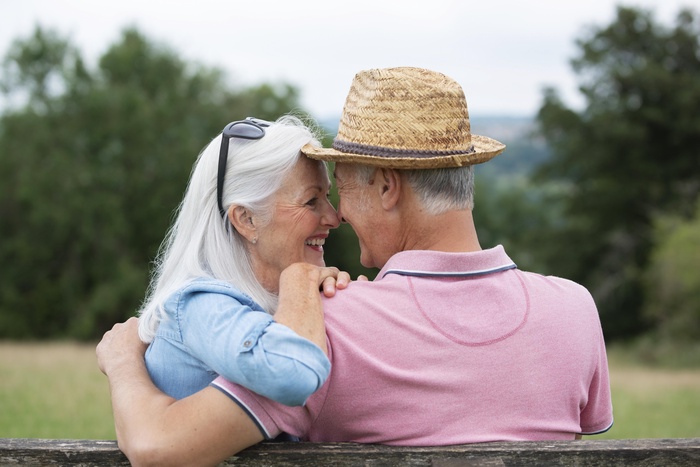 Older couple sharing a quiet moment together in a peaceful outdoor setting