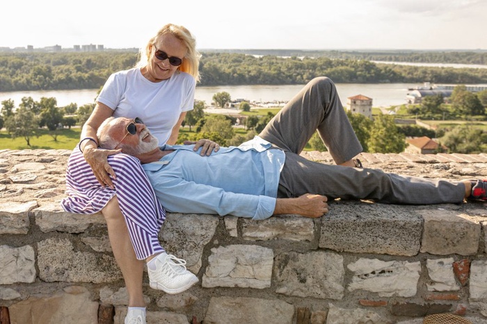 Mature couple enjoying a relaxed pause together outdoors