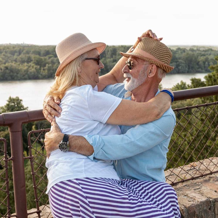 Older couple embracing by the waterfront in Port Orange, Florida