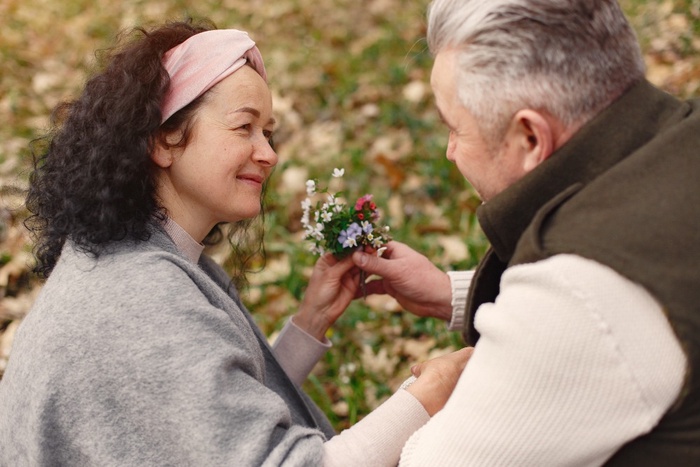 Mature couple with flowers in Borde Hill Garden