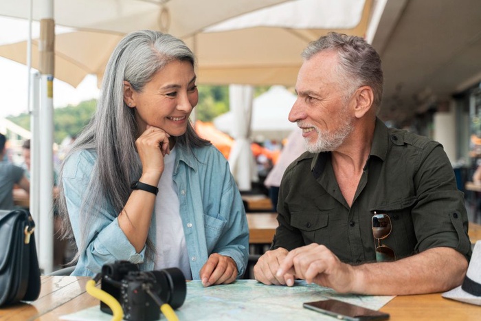 Singles over 50 talking at a cafe in Renton
