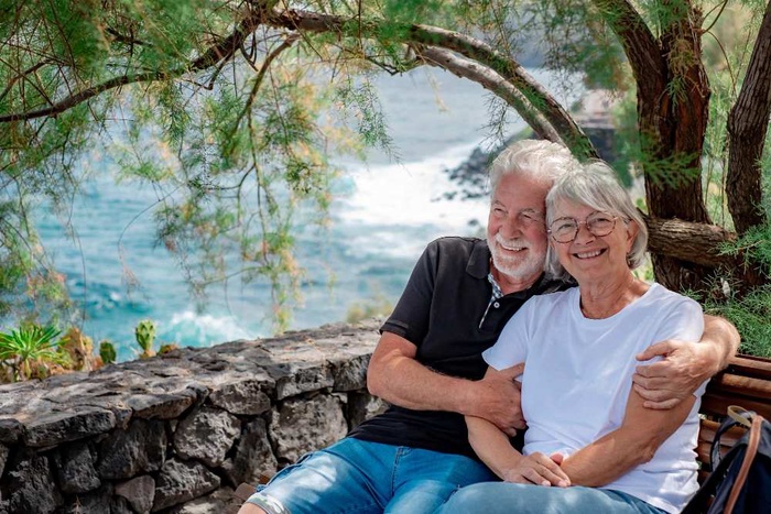 Senior couple relaxing by a lake in Wesley Chapel, Florida