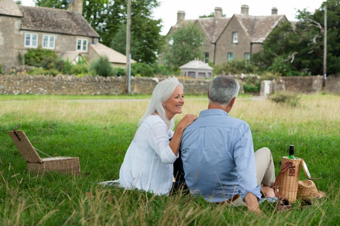 Mature couple picnicking on Castle Park grounds