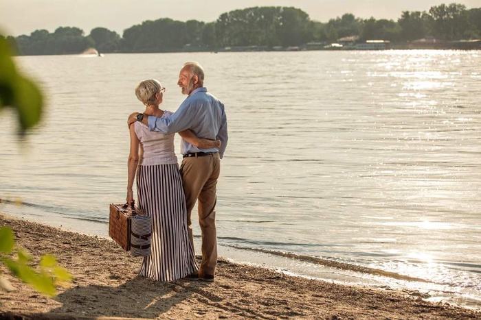 Older couple standing together by the river in Riverview, Florida