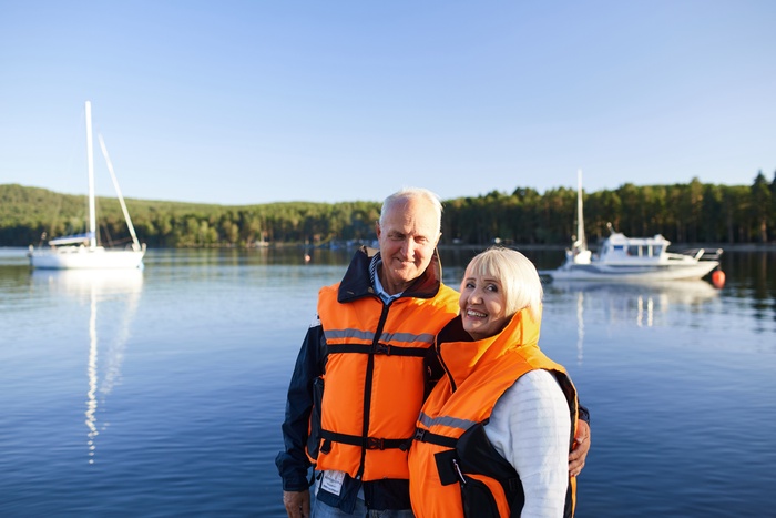 Senior couple enjoying time by the waterfront in Oakville, Ontario.