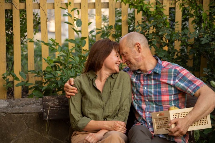 Older couple sitting close together in Hereford, England