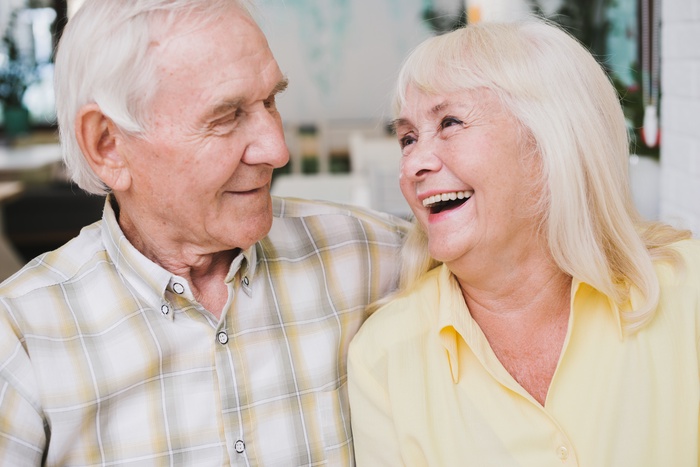 Older couple enjoying a relaxed conversation together