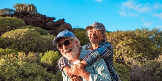 Older couple enjoying an active retirement outdoors