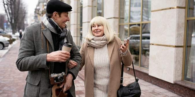Mature couple smiling on a small-town street