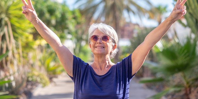 Happy senior woman enjoying life outdoors