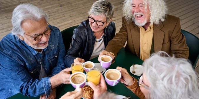 Older friends enjoying a social gathering together