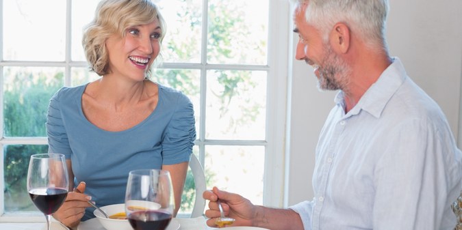 Mature couple enjoying dinner together