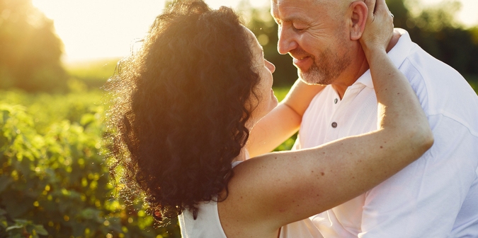 Mature couple embracing, finding love after 50