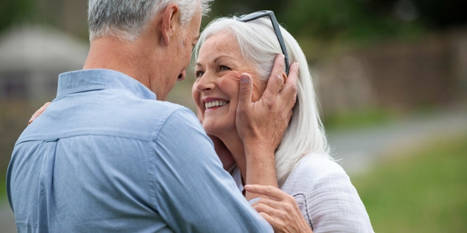 Senior couple sharing a romantic moment outdoors