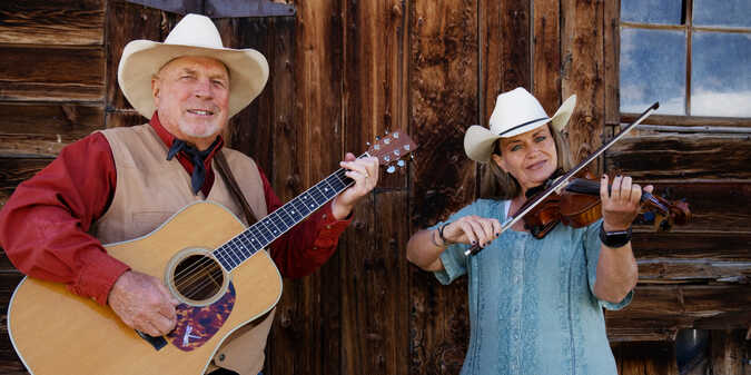 cowboy and cowgirl singing together