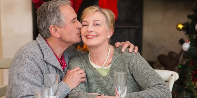 Senior couple celebrating together indoors